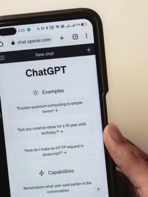 Webpage of ChatGPT, a prototype AI chatbot, is seen on the website of OpenAI, on a smartphone. Examples, capabilities, and limitations are shown.